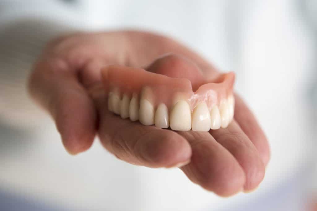 how to clean dentures